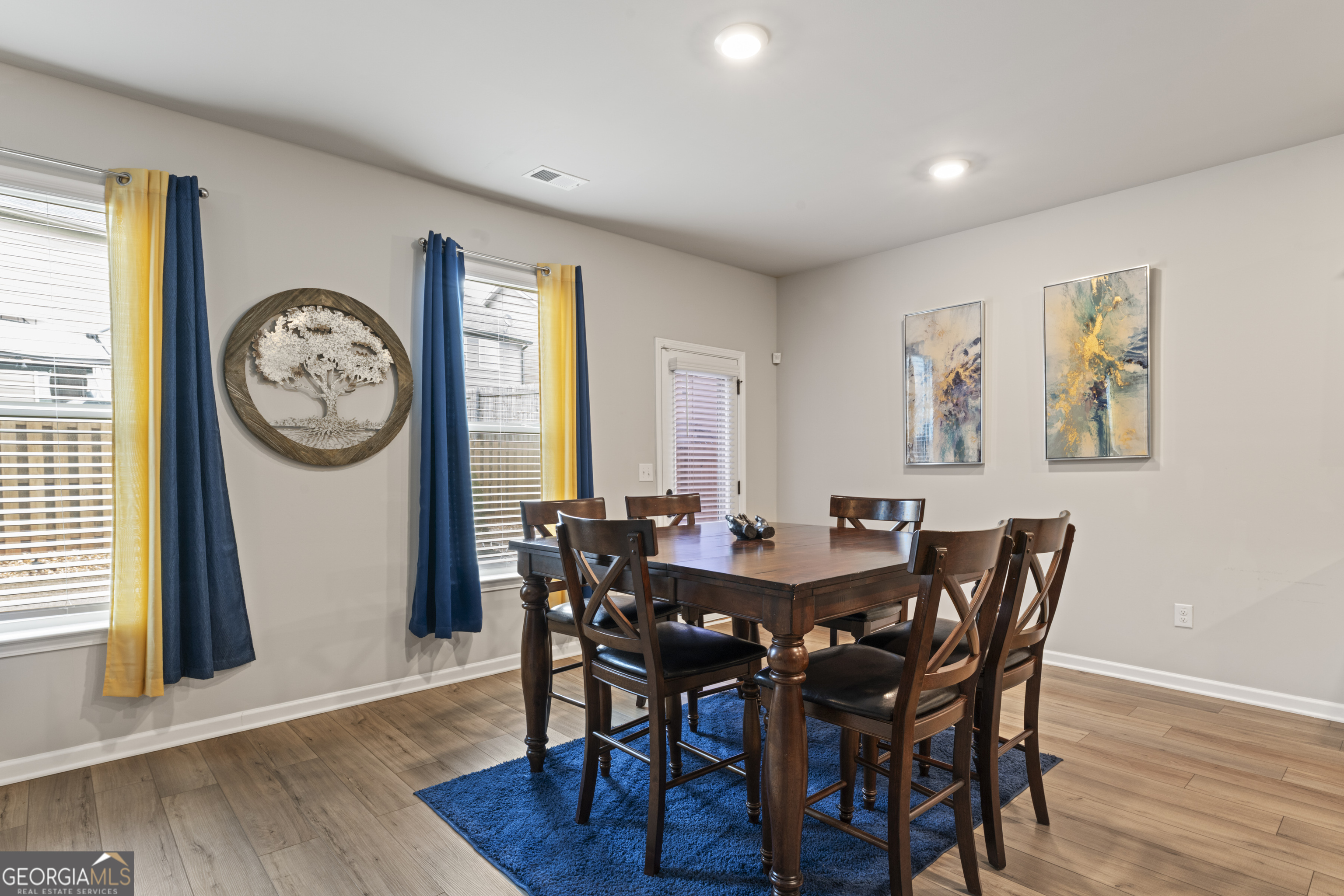 11940 Brightside Parkway Hampton, GA 30228 - Photo 13 of 29 a view of a dining room with furniture window and wooden floor