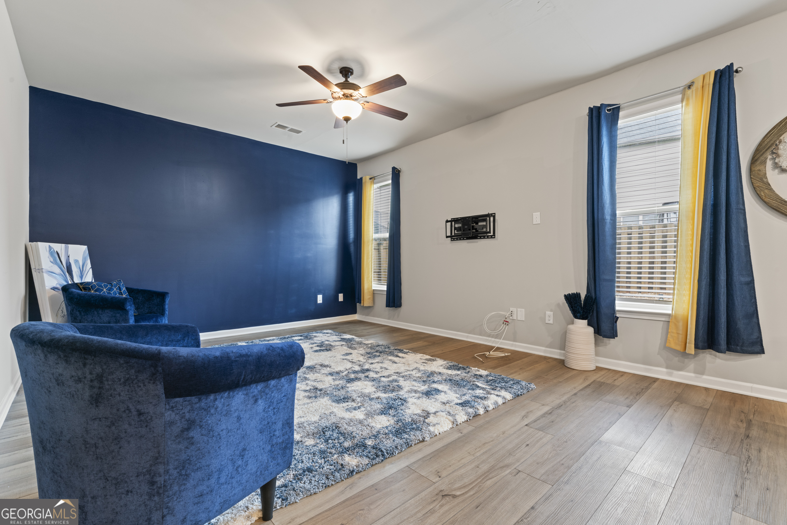 11940 Brightside Parkway Hampton, GA 30228 - Photo 14 of 29 a living room with couches and chandelier