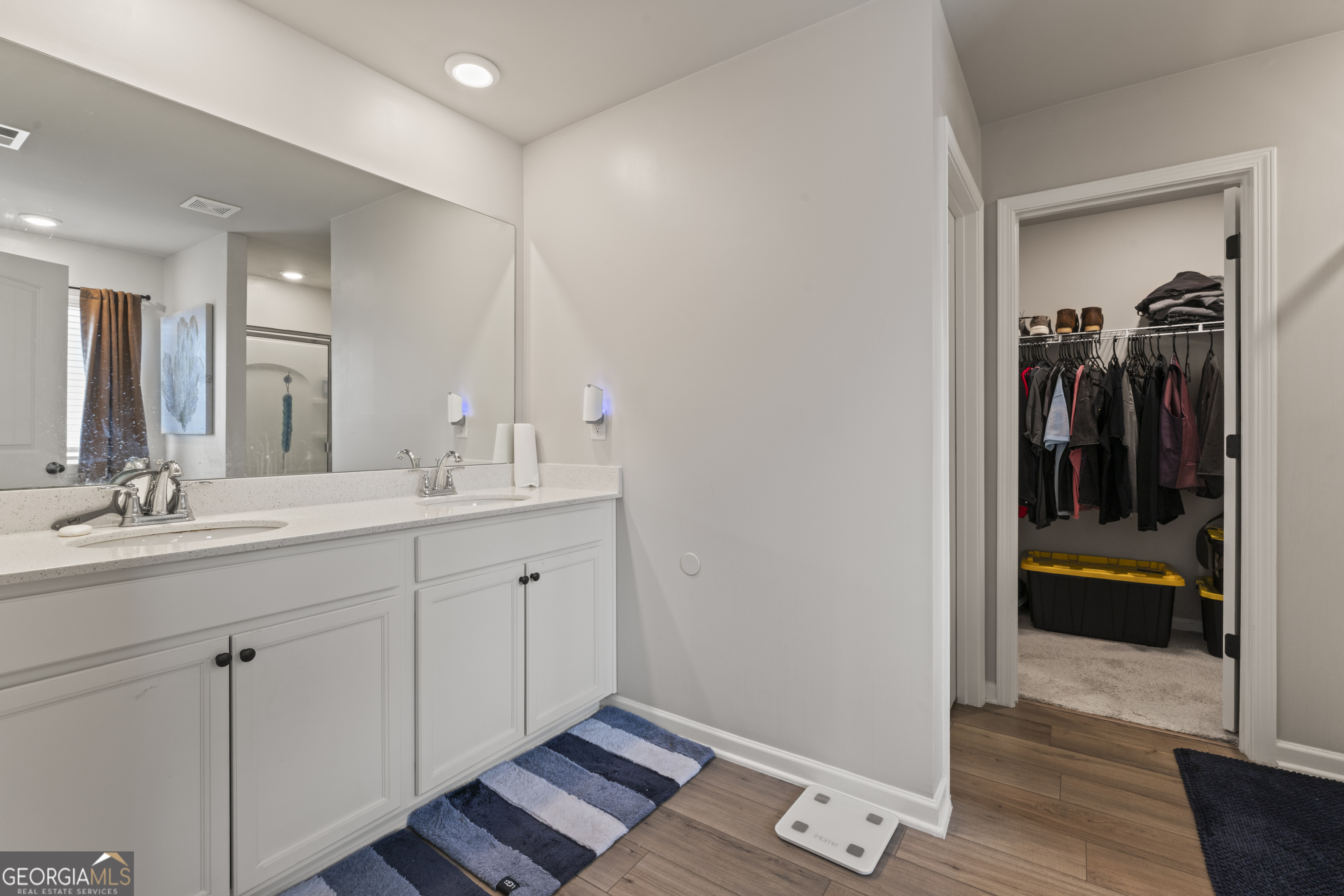 11940 Brightside Parkway Hampton, GA 30228 - Photo 17 of 29 a spacious bathroom with a double vanity sink and a mirror