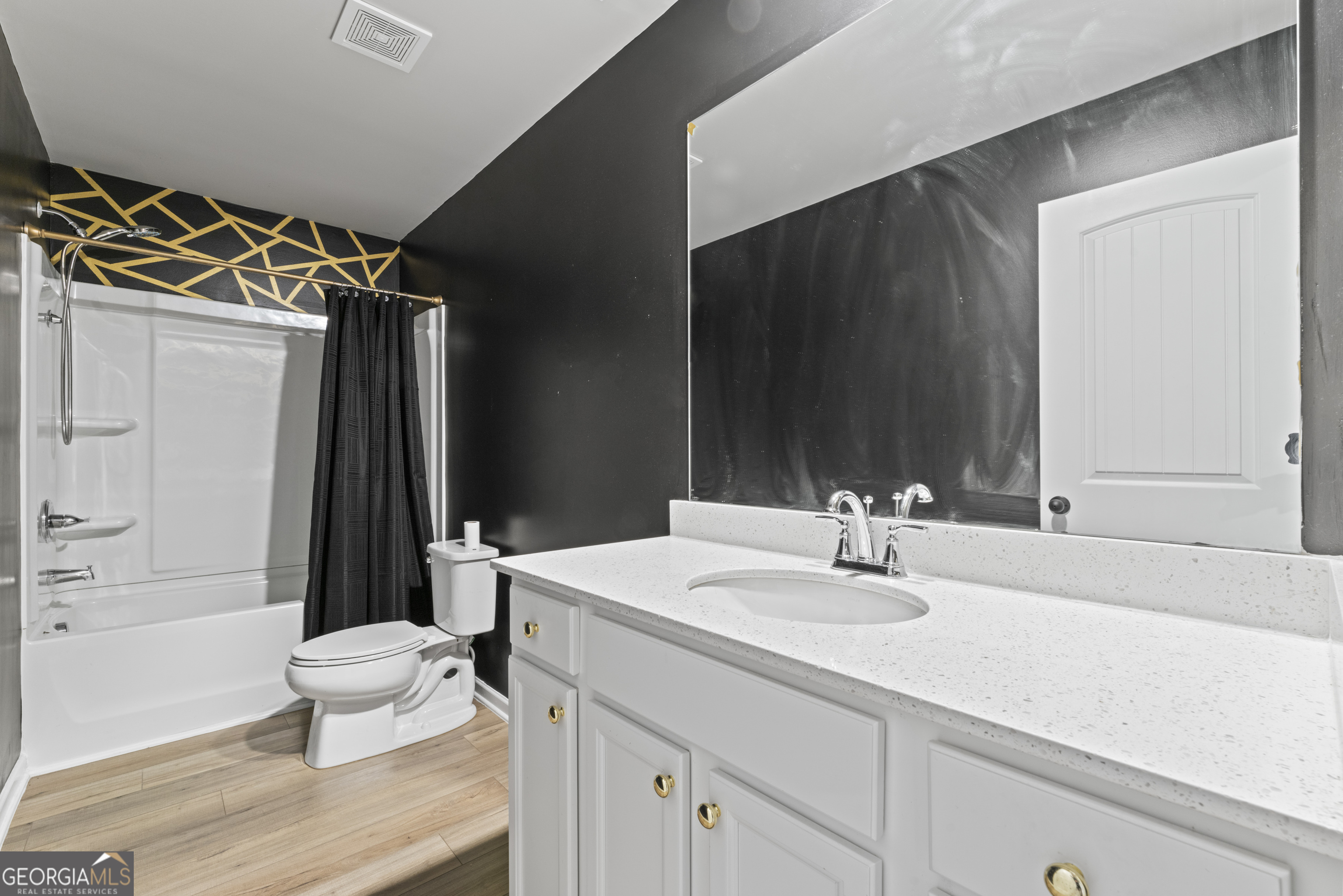 11940 Brightside Parkway Hampton, GA 30228 - Photo 20 of 29 a bathroom with a sink a toilet a mirror and shower