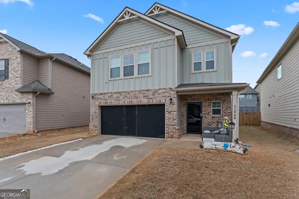 a front view of a house with a garage