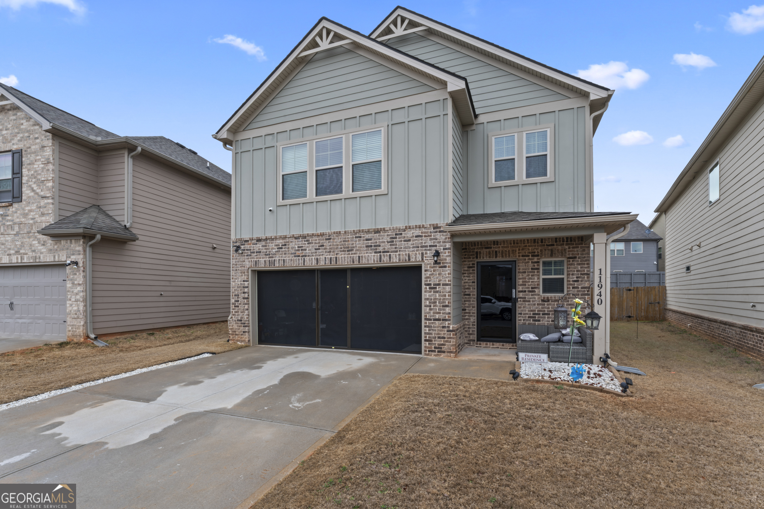 11940 Brightside Parkway Hampton, GA 30228 - Photo 2 of 29 a front view of a house with a garage