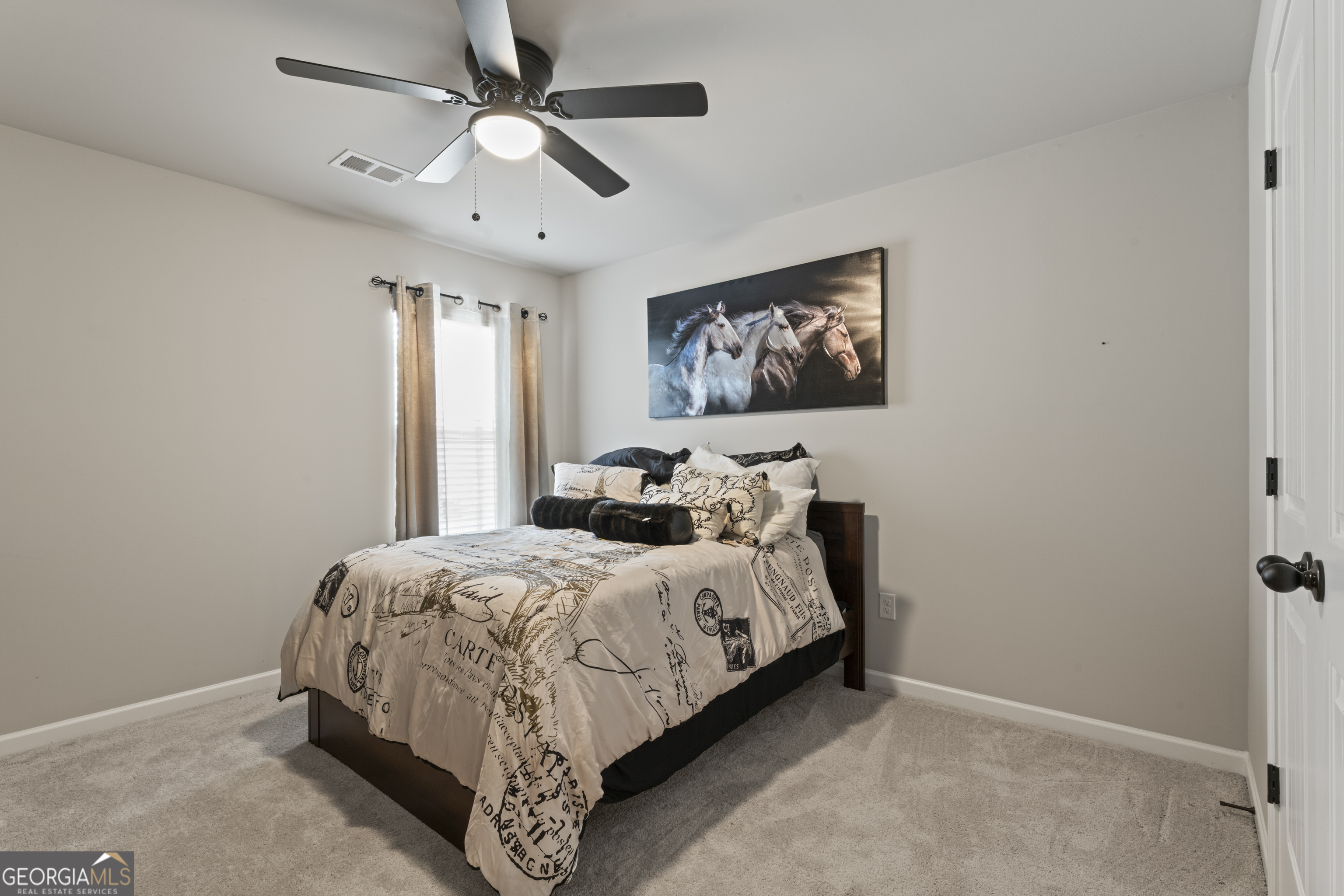 11940 Brightside Parkway Hampton, GA 30228 - Photo 21 of 29 a bedroom with bed and a window