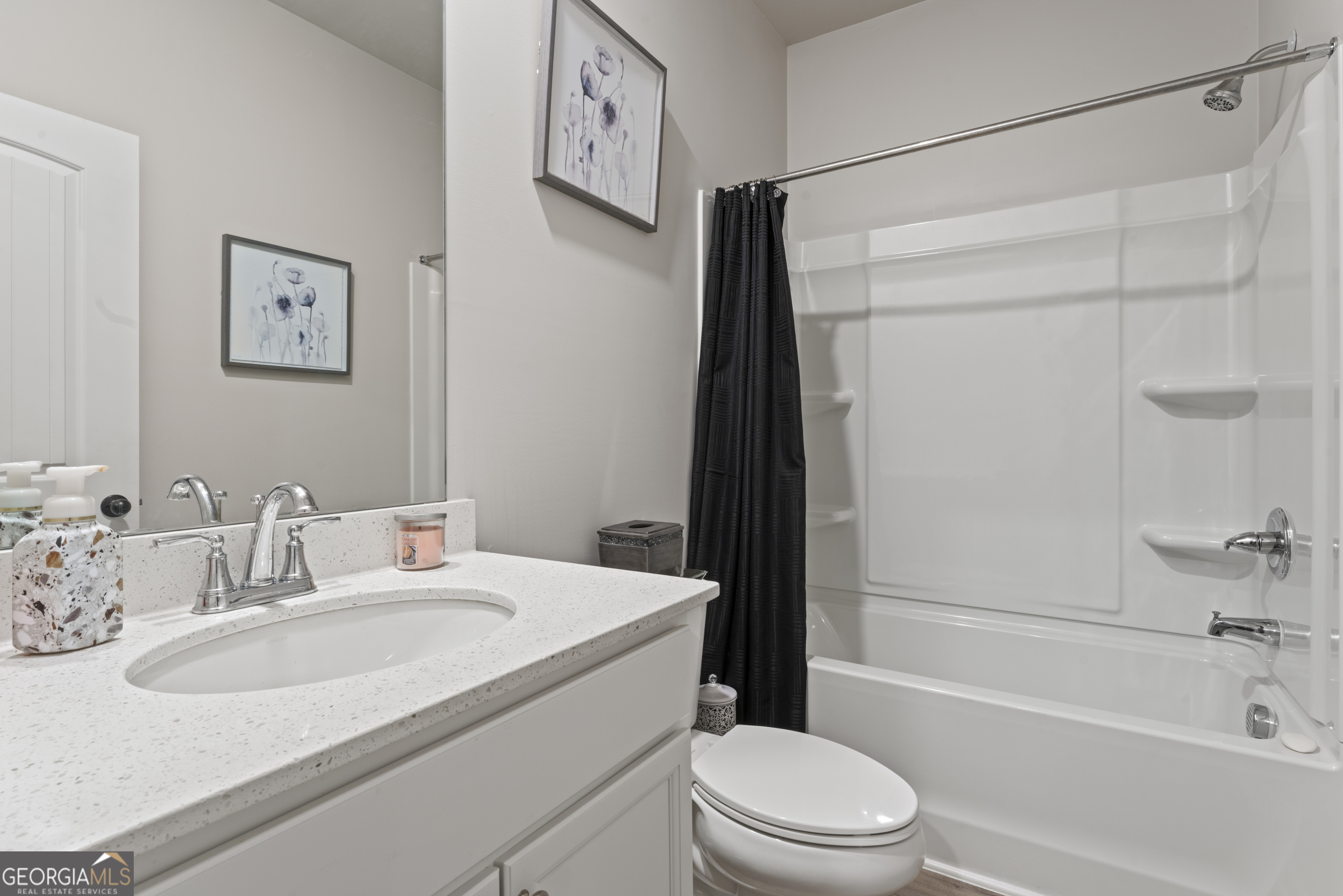 11940 Brightside Parkway Hampton, GA 30228 - Photo 22 of 29 a bathroom with a sink toilet and shower