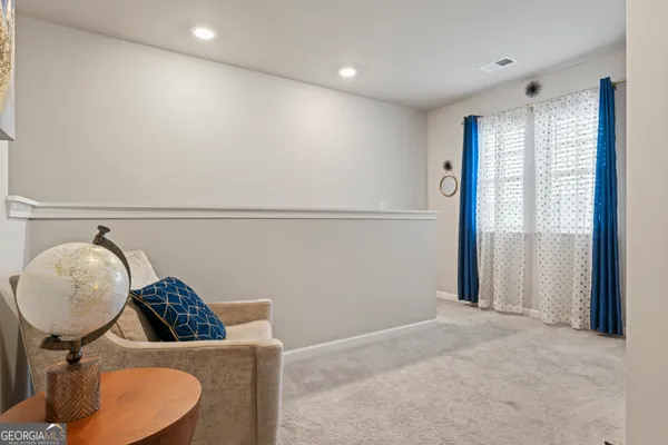 a view of workspace with furniture and window