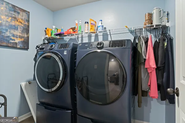 a utility room with dryer and washer