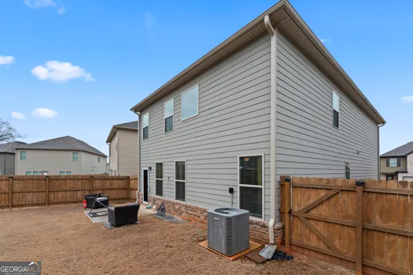 a view of backyard with seating space