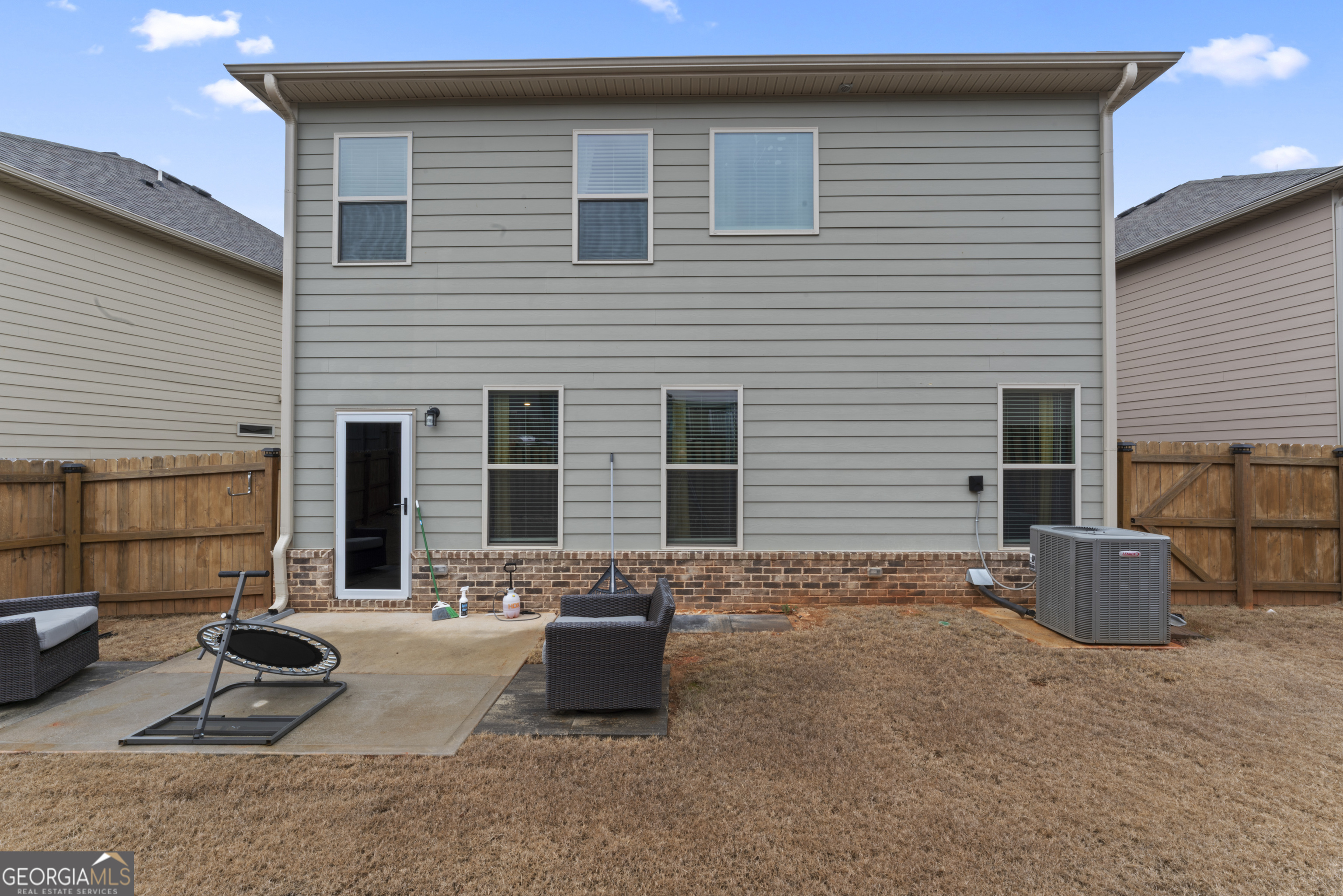 11940 Brightside Parkway Hampton, GA 30228 - Photo 29 of 29 a backyard of a house with seating space
