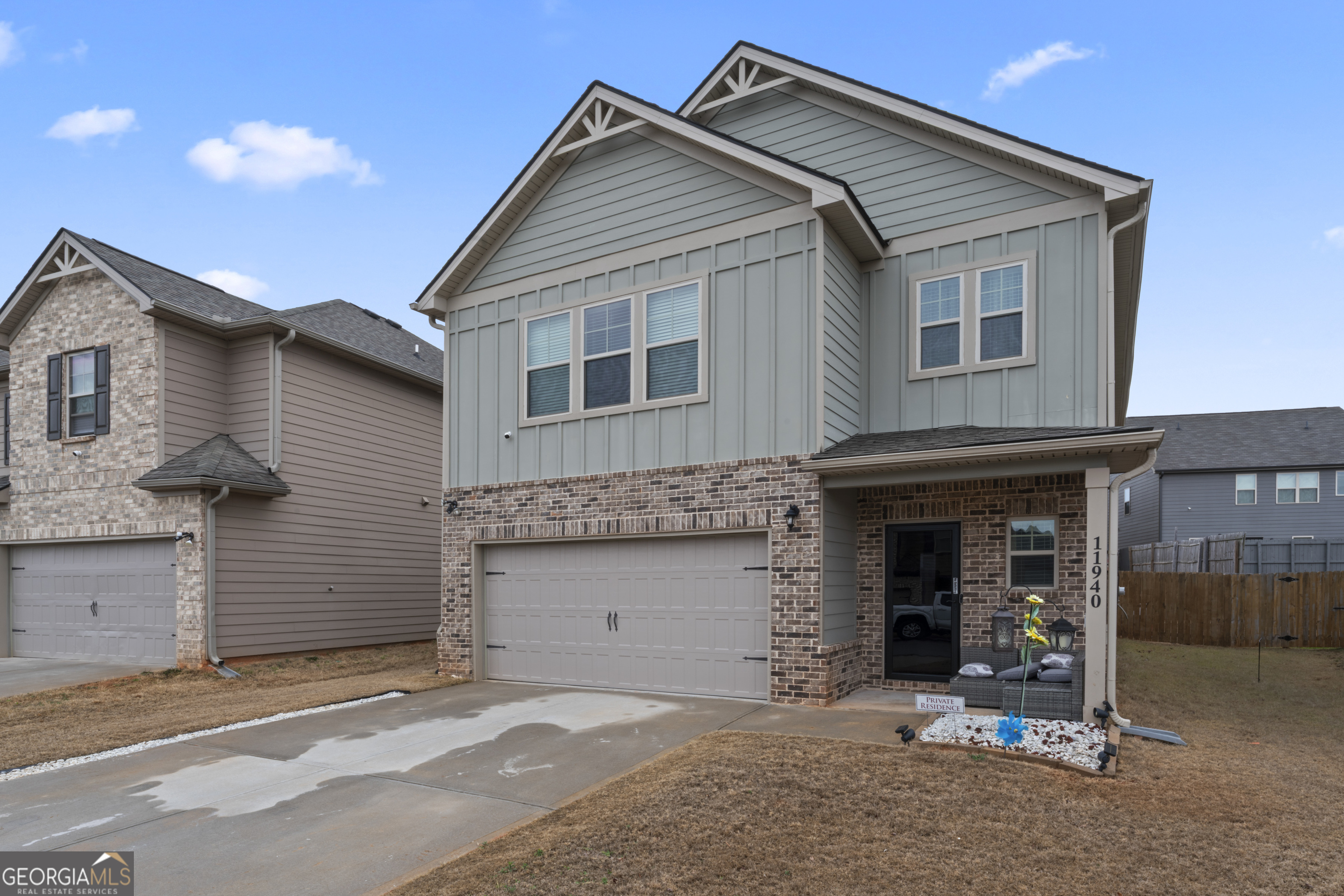 11940 Brightside Parkway Hampton, GA 30228 - Photo 5 of 29 a front view of a house with a garage