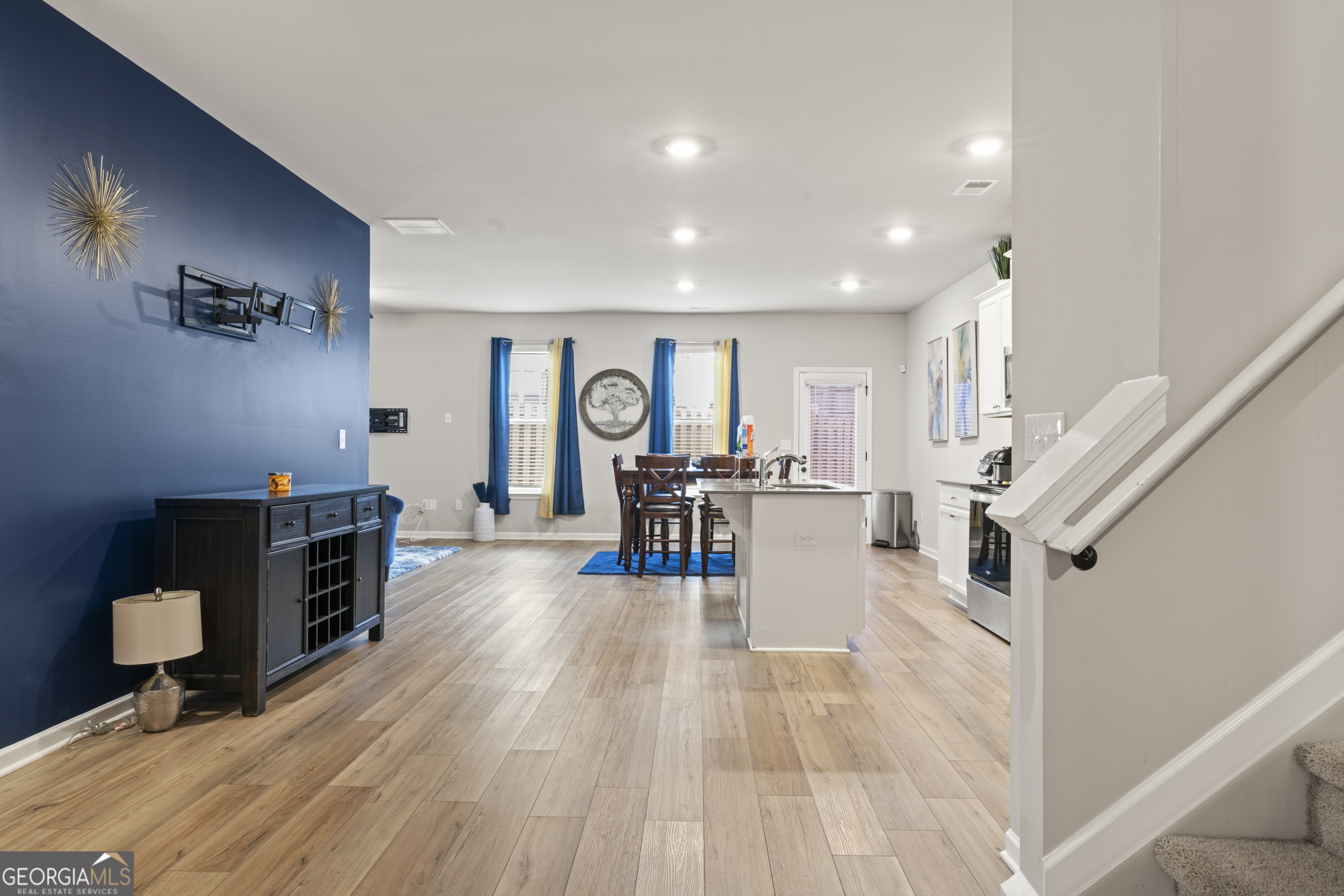 11940 Brightside Parkway Hampton, GA 30228 - Photo 8 of 29 a living room with furniture and a flat screen tv