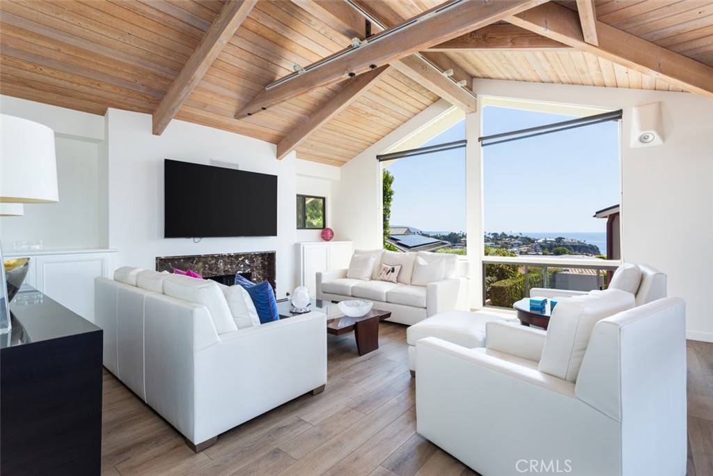 810 Emerald Bay Laguna Beach, CA 92651 - Photo 11 of 28 a living room with furniture and a flat screen tv