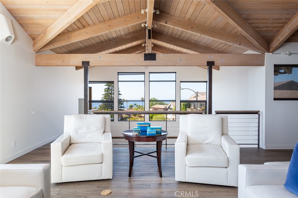 810 Emerald Bay Laguna Beach, CA 92651 - Photo 12 of 28 a living room with furniture and a large window