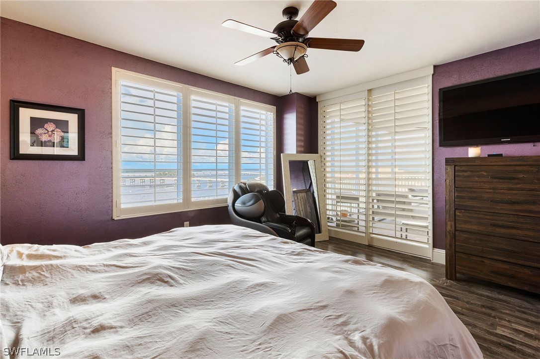 2104 West First Street, Unit 1404 Fort Myers, FL 33901 - Photo 19 of 30 a bedroom with a bed and a television