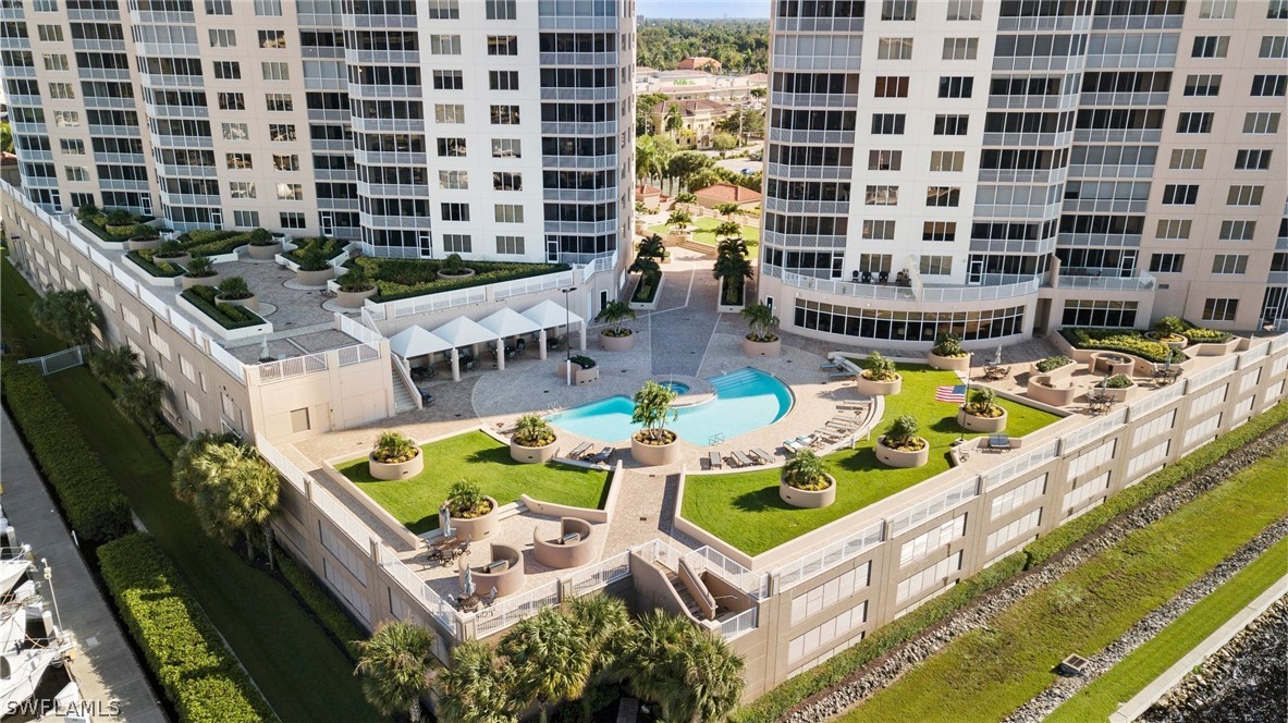 2104 West First Street, Unit 1404 Fort Myers, FL 33901 - Photo 2 of 30 a view of swimming pool with outdoor seating