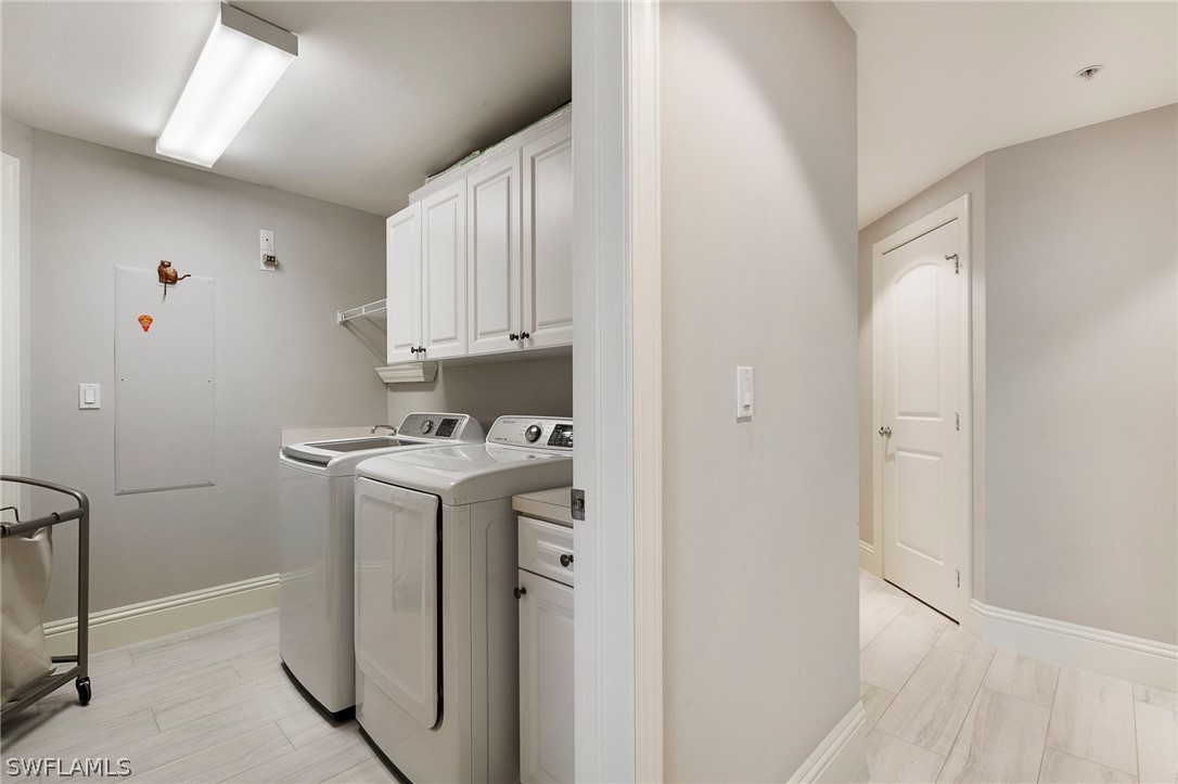 2104 West First Street, Unit 1404 Fort Myers, FL 33901 - Photo 27 of 30 a utility room with dryer and washer