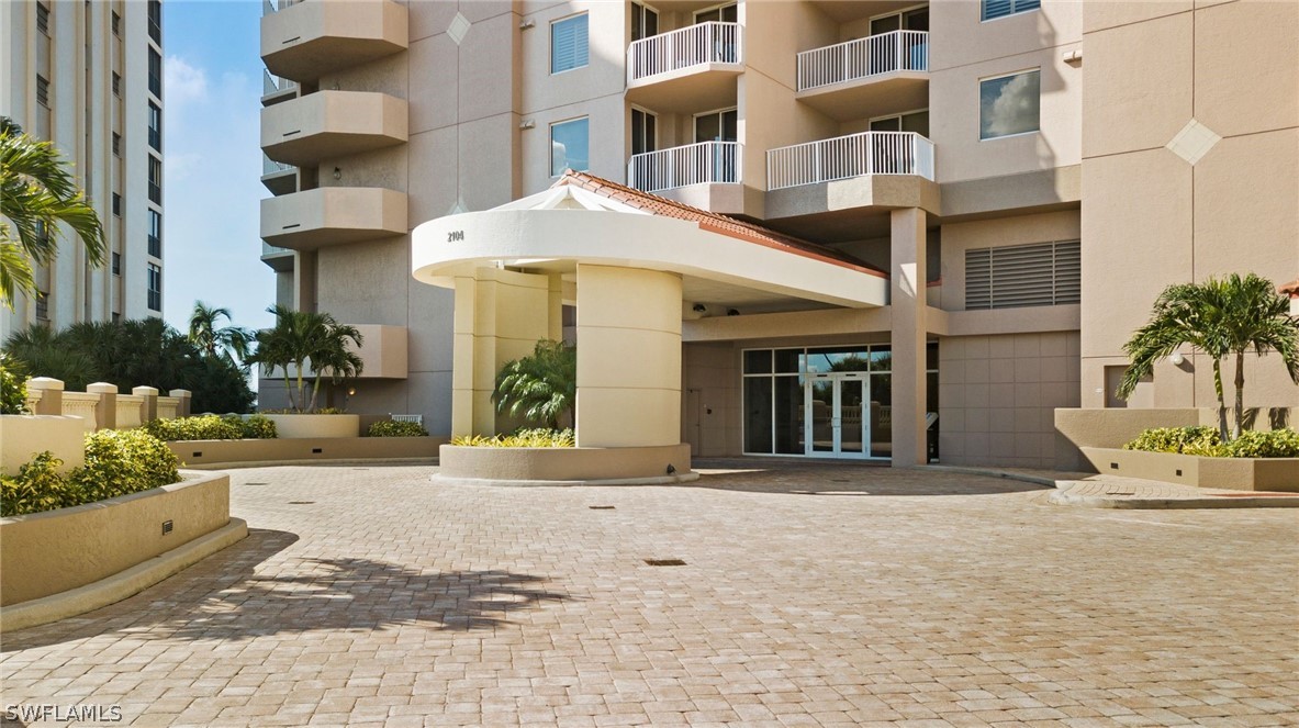 2104 West First Street, Unit 1404 Fort Myers, FL 33901 - Photo 5 of 30 a view of a building with potted plants