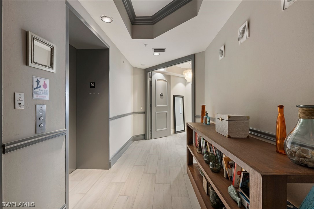 2104 West First Street, Unit 1404 Fort Myers, FL 33901 - Photo 6 of 30 a kitchen with stainless steel appliances granite countertop a refrigerator and a stove