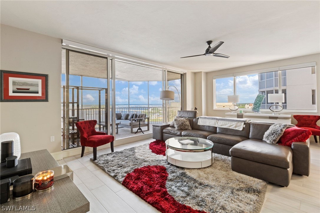 2104 West First Street, Unit 1404 Fort Myers, FL 33901 - Photo 10 of 30 a living room with furniture and a large window