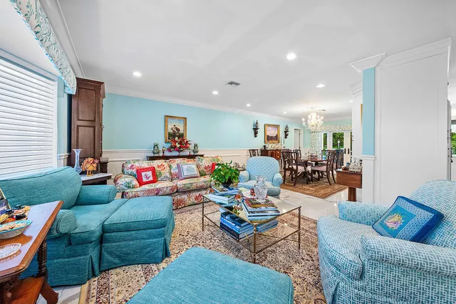 a kitchen with stainless steel appliances kitchen island granite countertop a stove and a sink