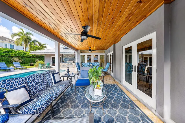 a swimming pool with outdoor seating yard and barbeque oven