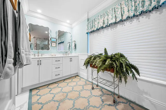 a spacious bathroom with a sink a mirror a bathtub and a shower