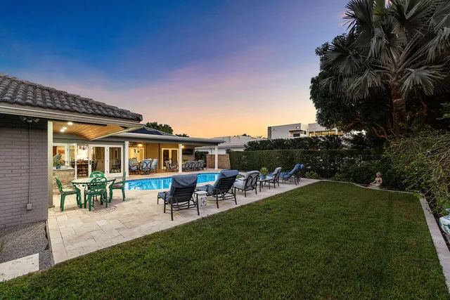 a kitchen with stainless steel appliances kitchen island granite countertop a stove a sink and a microwave