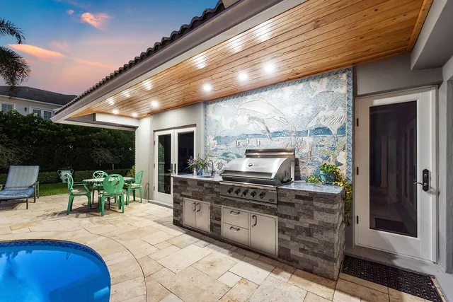 an aerial view of a house with a yard and garden