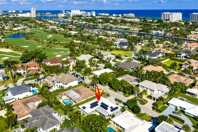 a view of a chair and table in backyard of the house