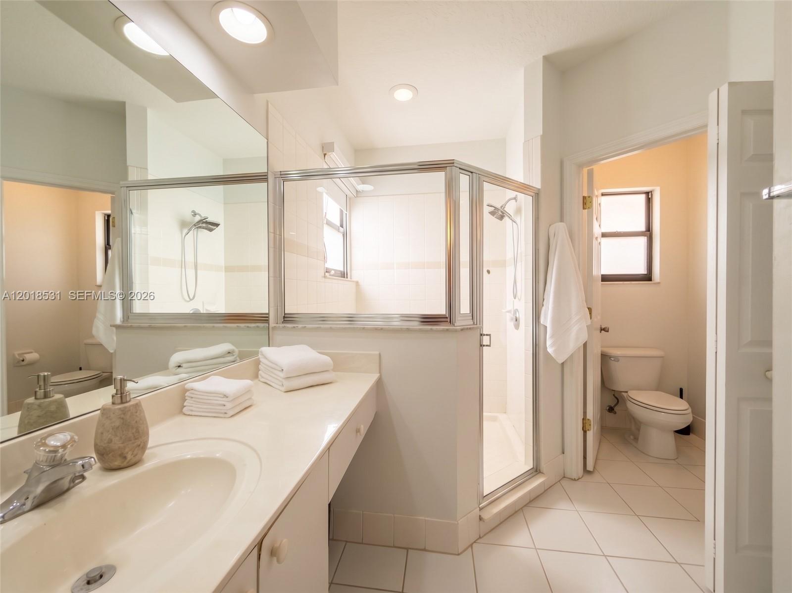 1575 Southeast 20th Road Homestead, FL 33035 - Photo 10 of 19 a bathroom with a sink toilet and shower