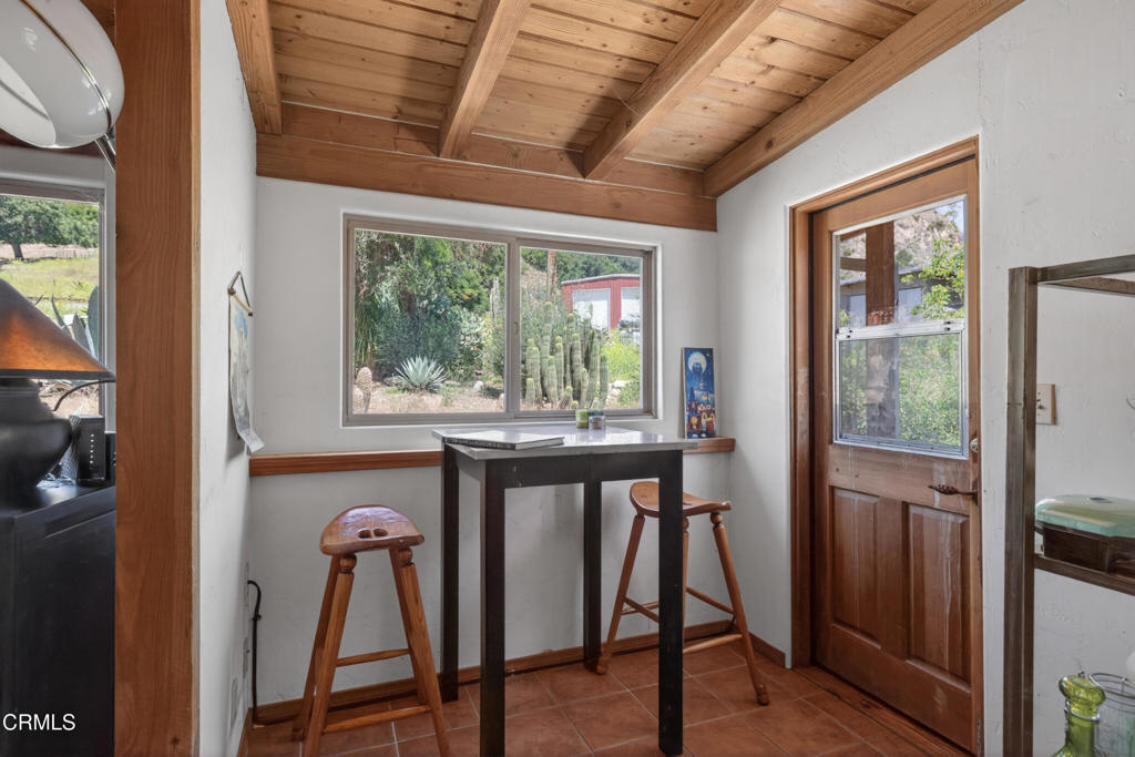 8416 Wheeler Canyon Road Santa Paula, CA 93060 - Photo 15 of 48 a view of a room with furniture wooden floor and a window
