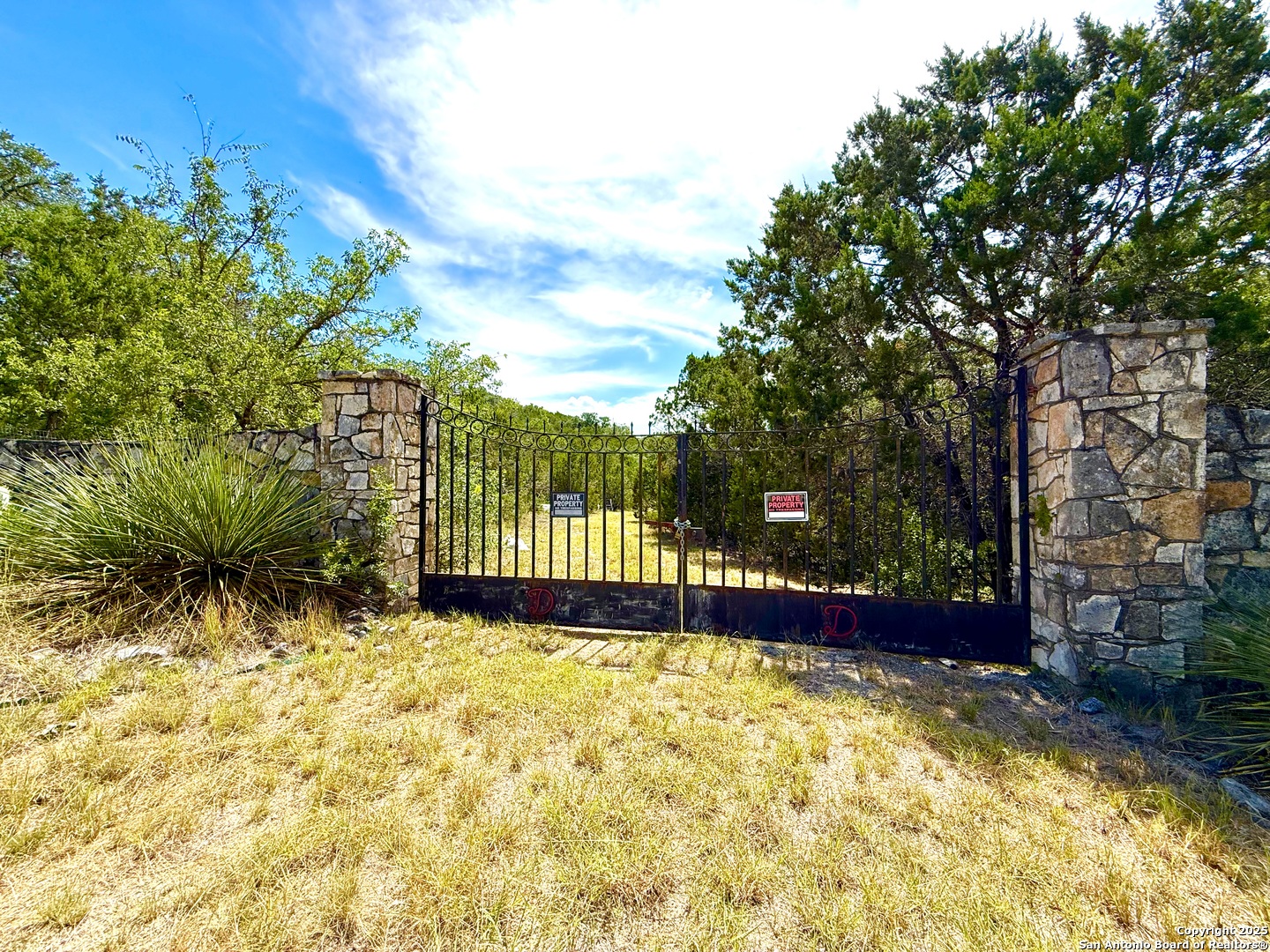 9852 Marnoch Road Helotes, TX 78023 - Photo 11 of 23 a view of yard with wooden fence