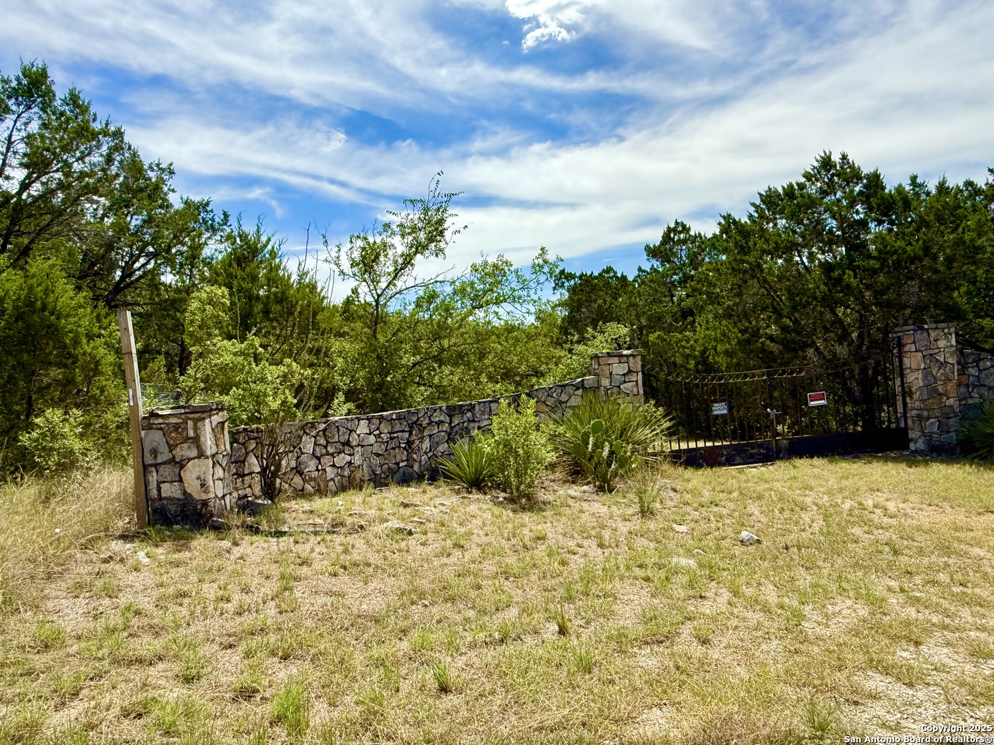 9852 Marnoch Road Helotes, TX 78023 - Photo 3 of 14 a street view with sitting space