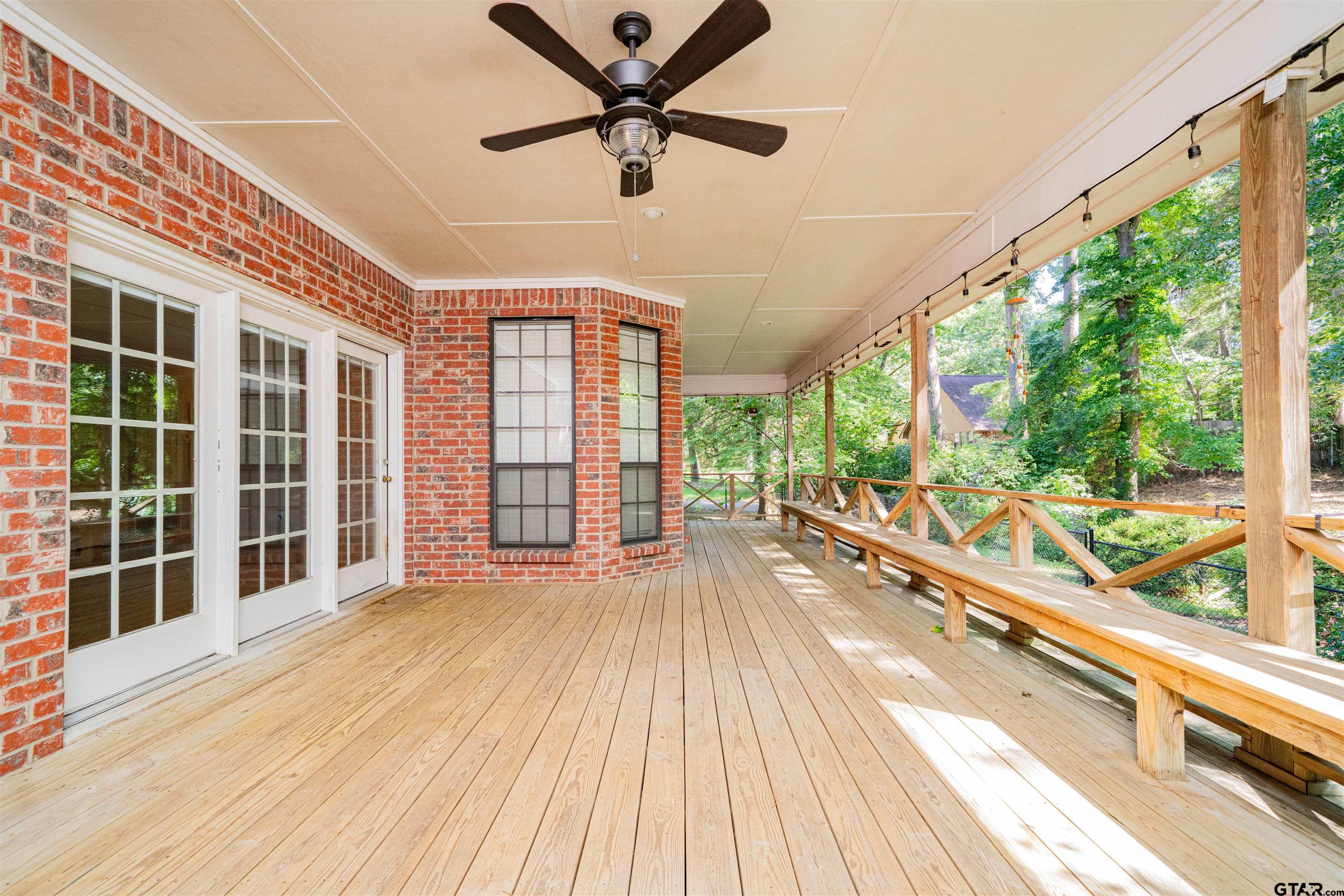 9211 Elm Tree Circle Tyler, TX 75703 - Photo 22 of 31 a view of a house with wooden floor and outdoor space