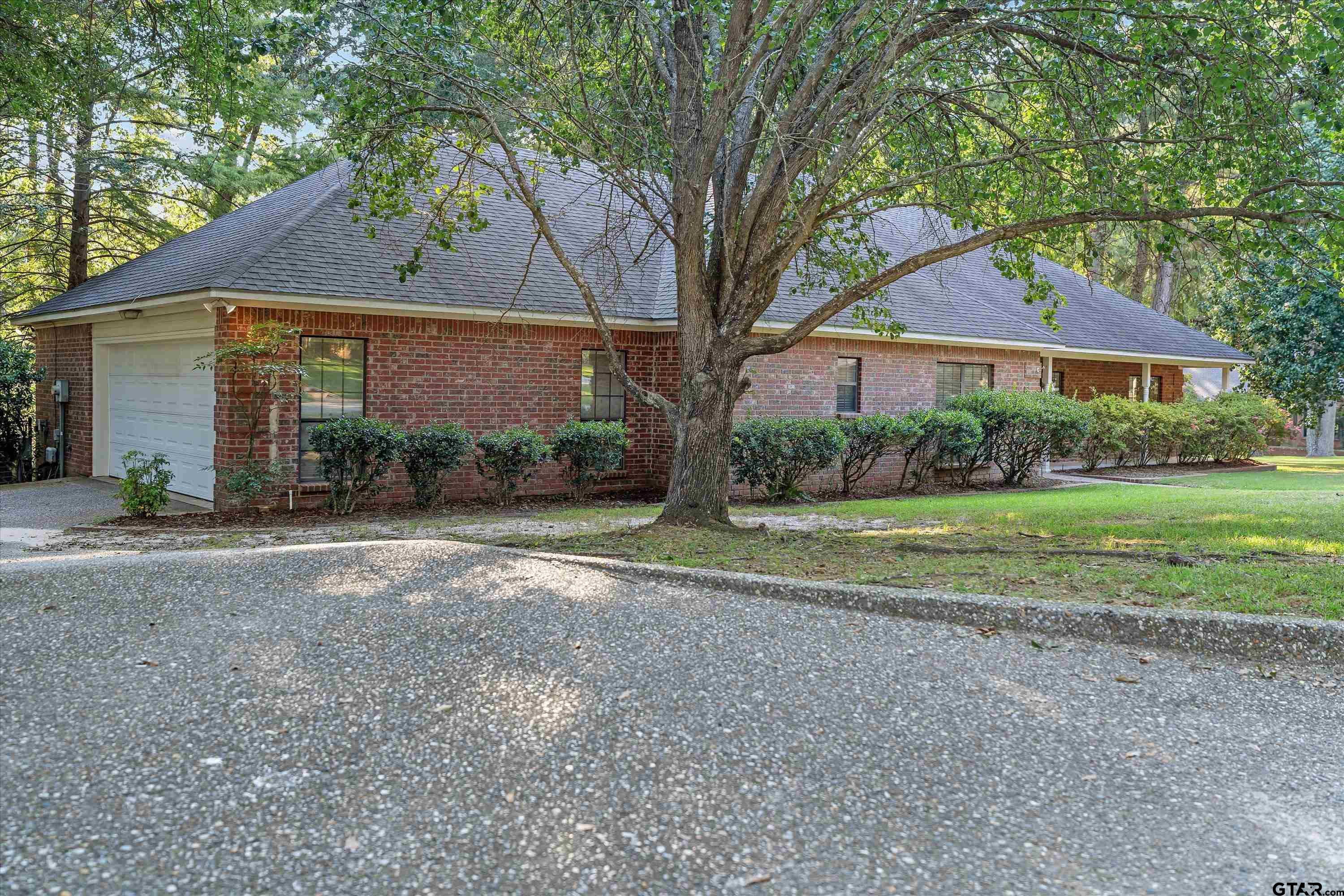 9211 Elm Tree Circle Tyler, TX 75703 - Photo 26 of 31 a view of a house with a yard