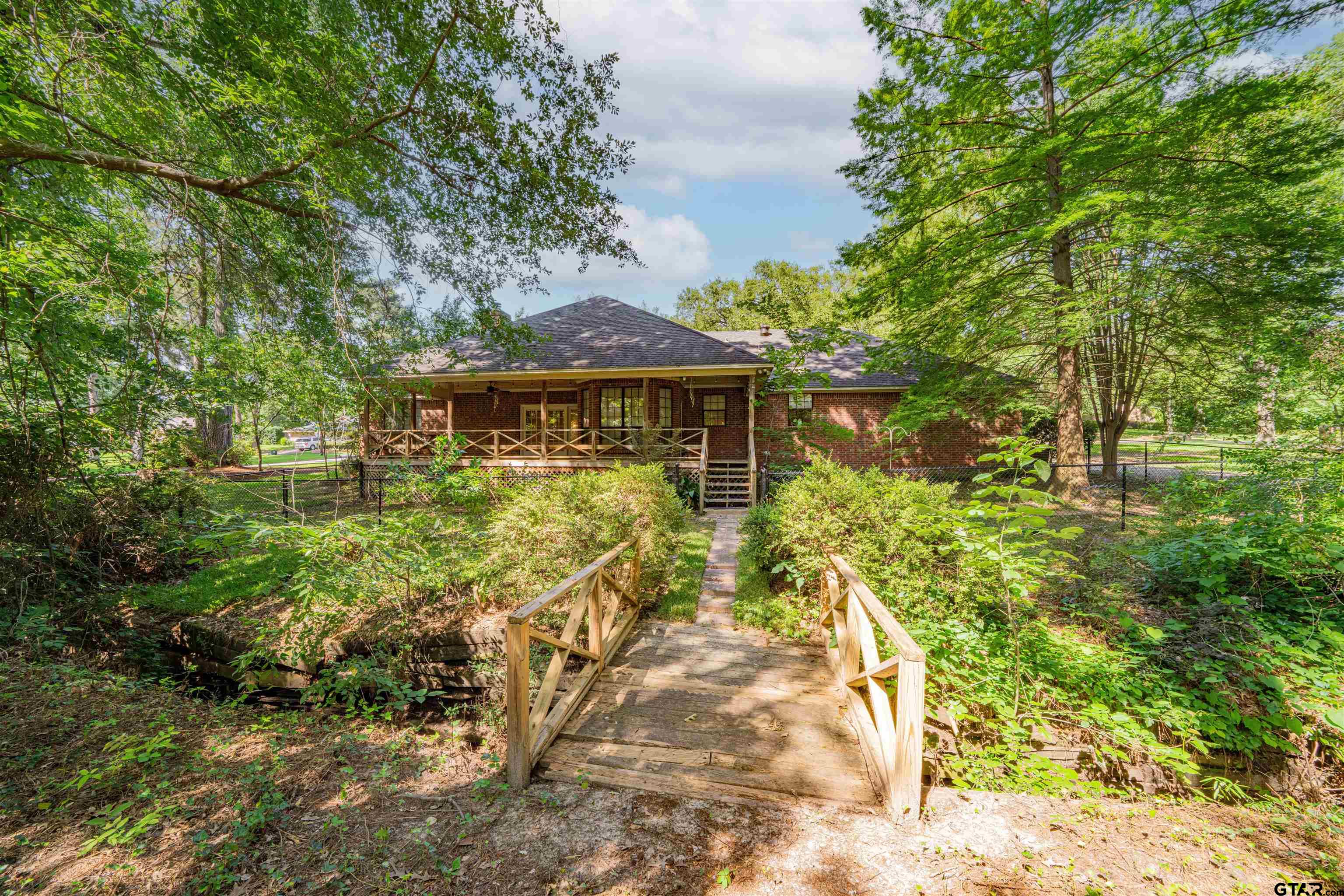 9211 Elm Tree Circle Tyler, TX 75703 - Photo 29 of 31 a view of a house with a yard
