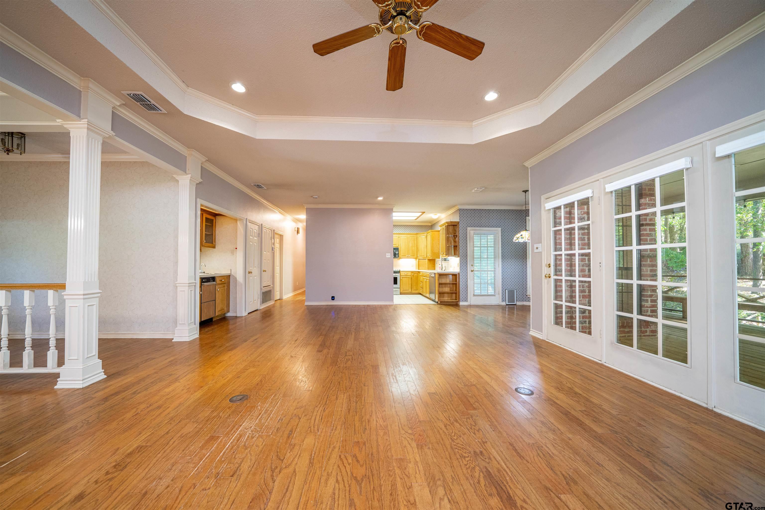9211 Elm Tree Circle Tyler, TX 75703 - Photo 7 of 31 a view of empty room with wooden floor and fan