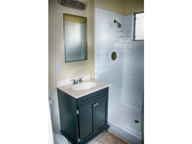 3283 Axford Road Santa Cruz, CA 95062 - Photo 7 of 15 a bathroom with a sink a mirror and shower