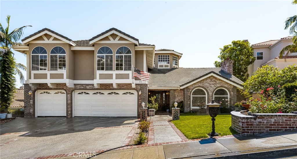 21 Marbella San Clemente, CA 92673 - Photo 1 of 1 a front view of a house with garden