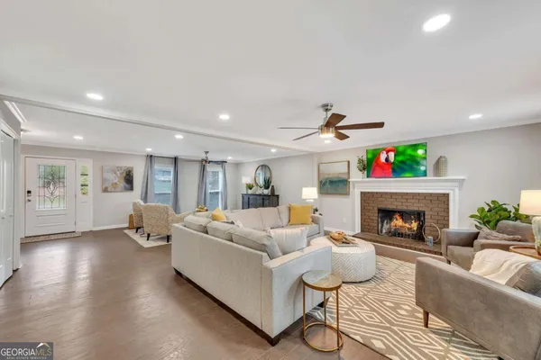 a living room with furniture and a fireplace