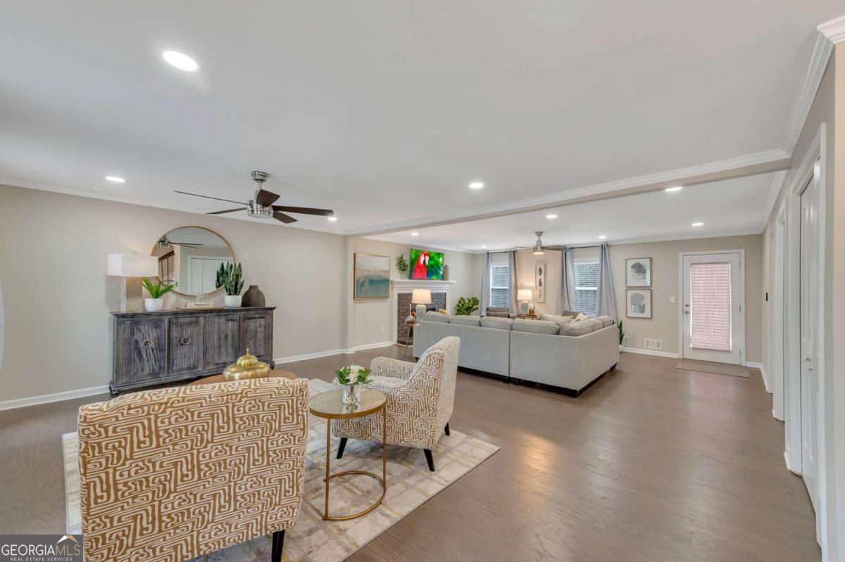 6805 Wright Road Northeast Atlanta, GA 30328 - Photo 2 of 28 a living room with furniture and wooden floor