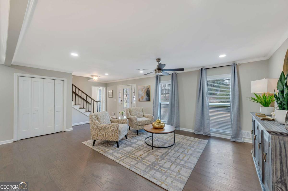 6805 Wright Road Northeast Atlanta, GA 30328 - Photo 4 of 28 a living room with furniture and a potted plant