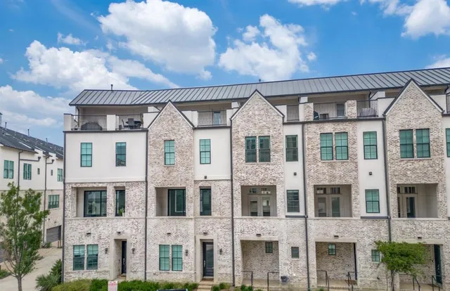 a front view of a residential apartment building with windows