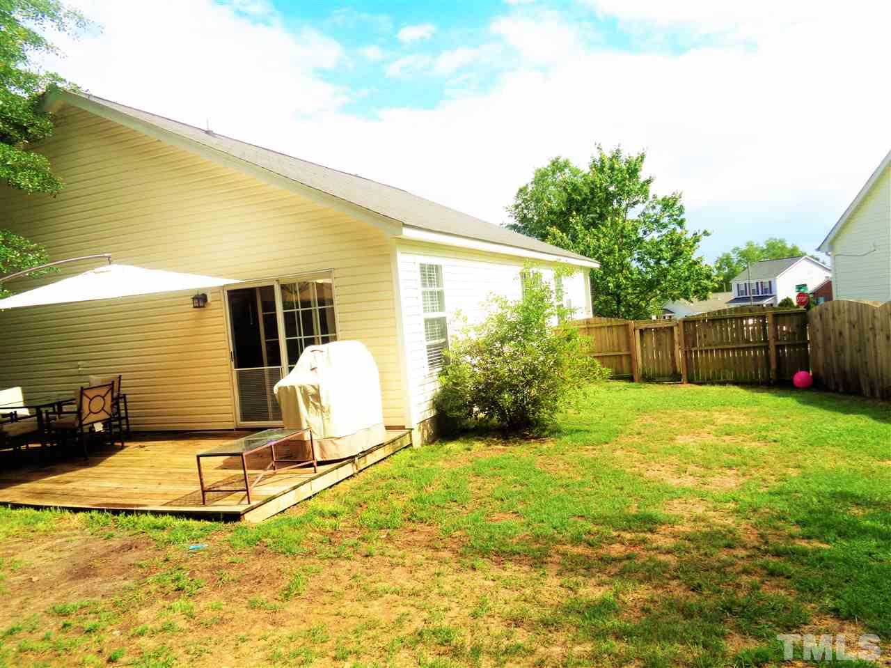 5304 Graymar Court Raleigh, NC 27616 - Photo 20 of 25 a view of a backyard with table and chairs and potted plants
