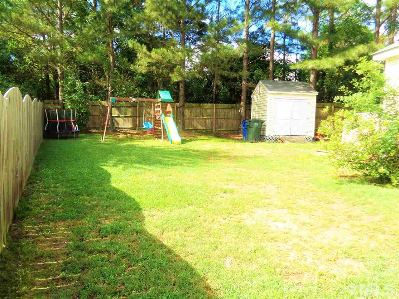 5304 Graymar Court Raleigh, NC 27616 - Photo 22 of 25 a view of a yard with a tree