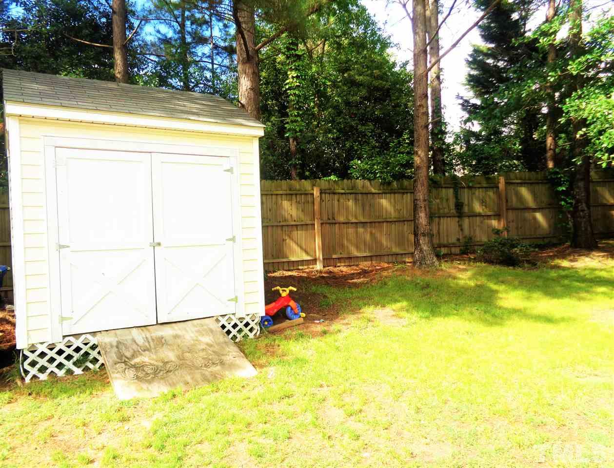 5304 Graymar Court Raleigh, NC 27616 - Photo 23 of 25 a view of a backyard with a small cabin