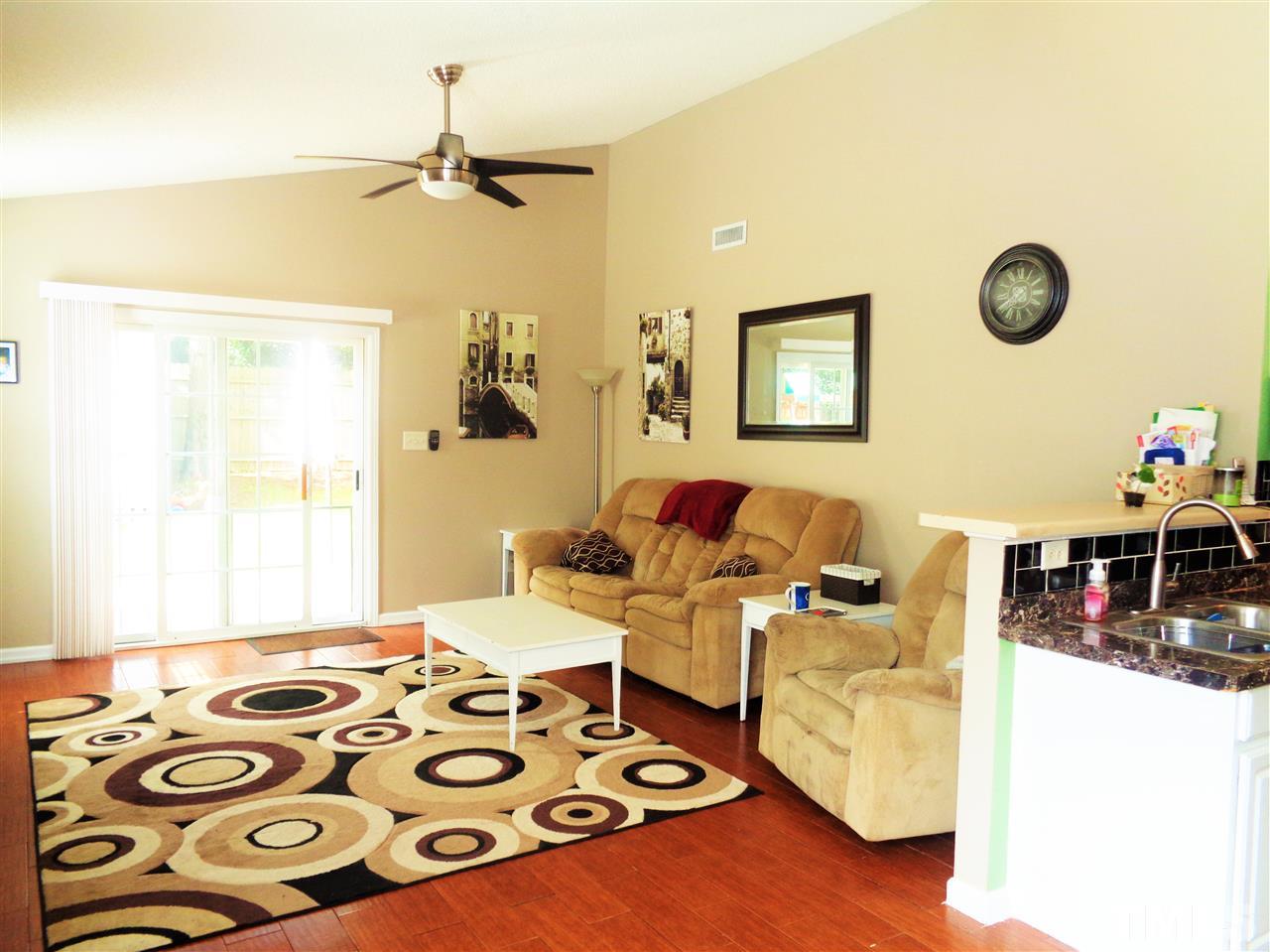 5304 Graymar Court Raleigh, NC 27616 - Photo 5 of 25 a living room with furniture and a flat screen tv