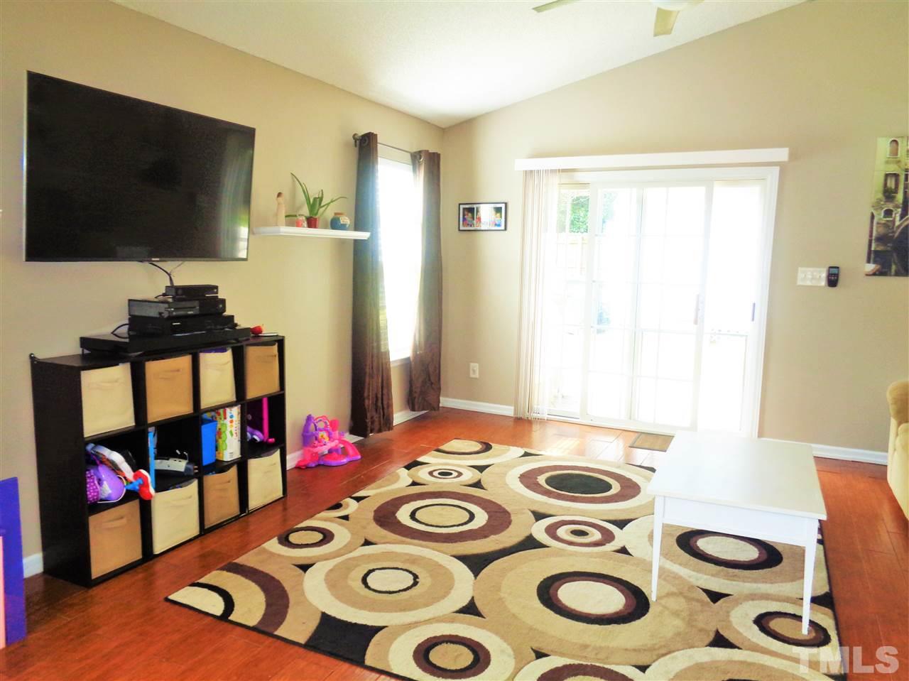 5304 Graymar Court Raleigh, NC 27616 - Photo 6 of 25 a bedroom with a bed and a flat screen tv