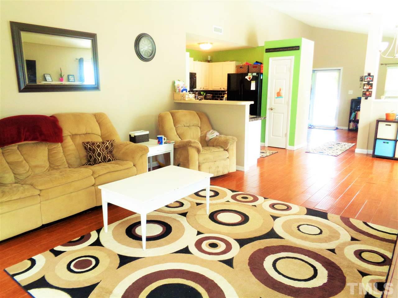 5304 Graymar Court Raleigh, NC 27616 - Photo 7 of 25 a living room filled and dining table with rug