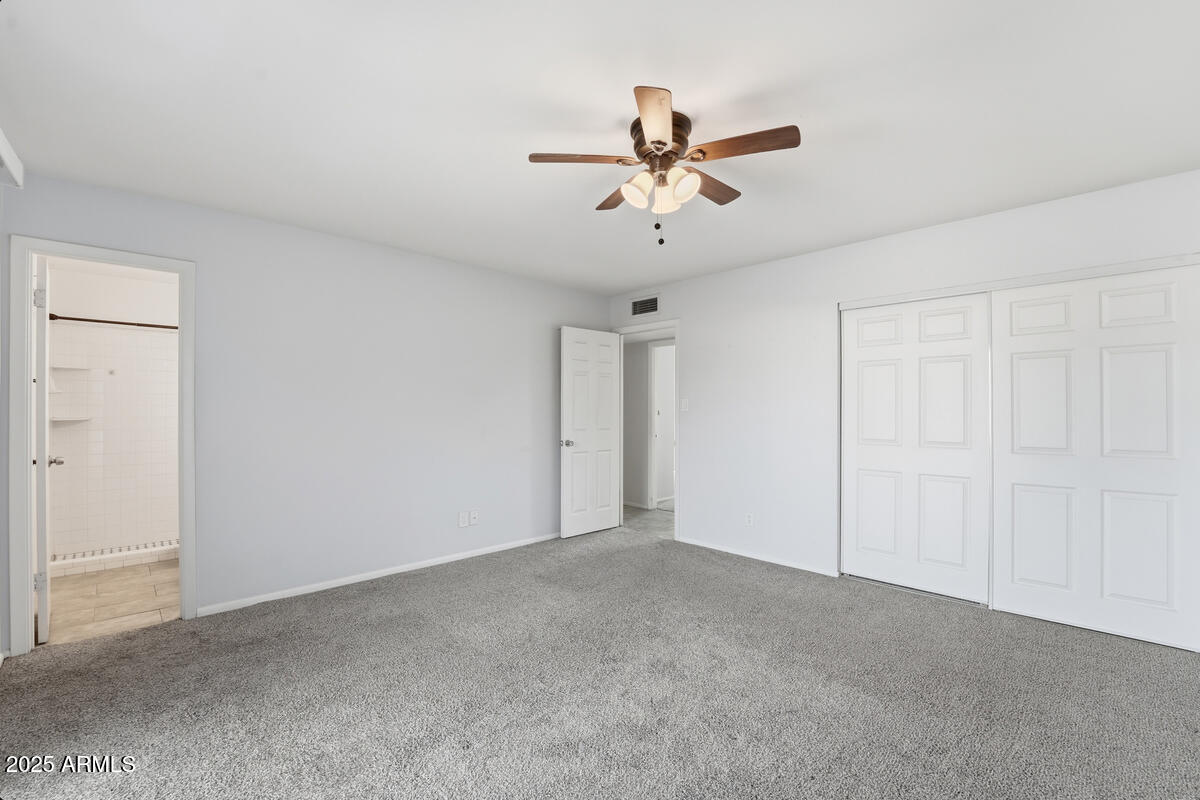 1644 East Broadmor Drive Tempe, AZ 85282 - Photo 11 of 49 a view of a big room with carpet