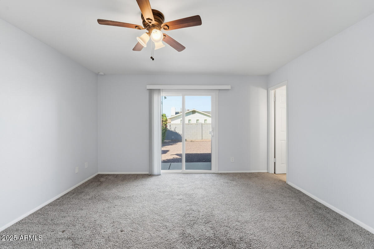 1644 East Broadmor Drive Tempe, AZ 85282 - Photo 12 of 49 a view of an empty room with a window